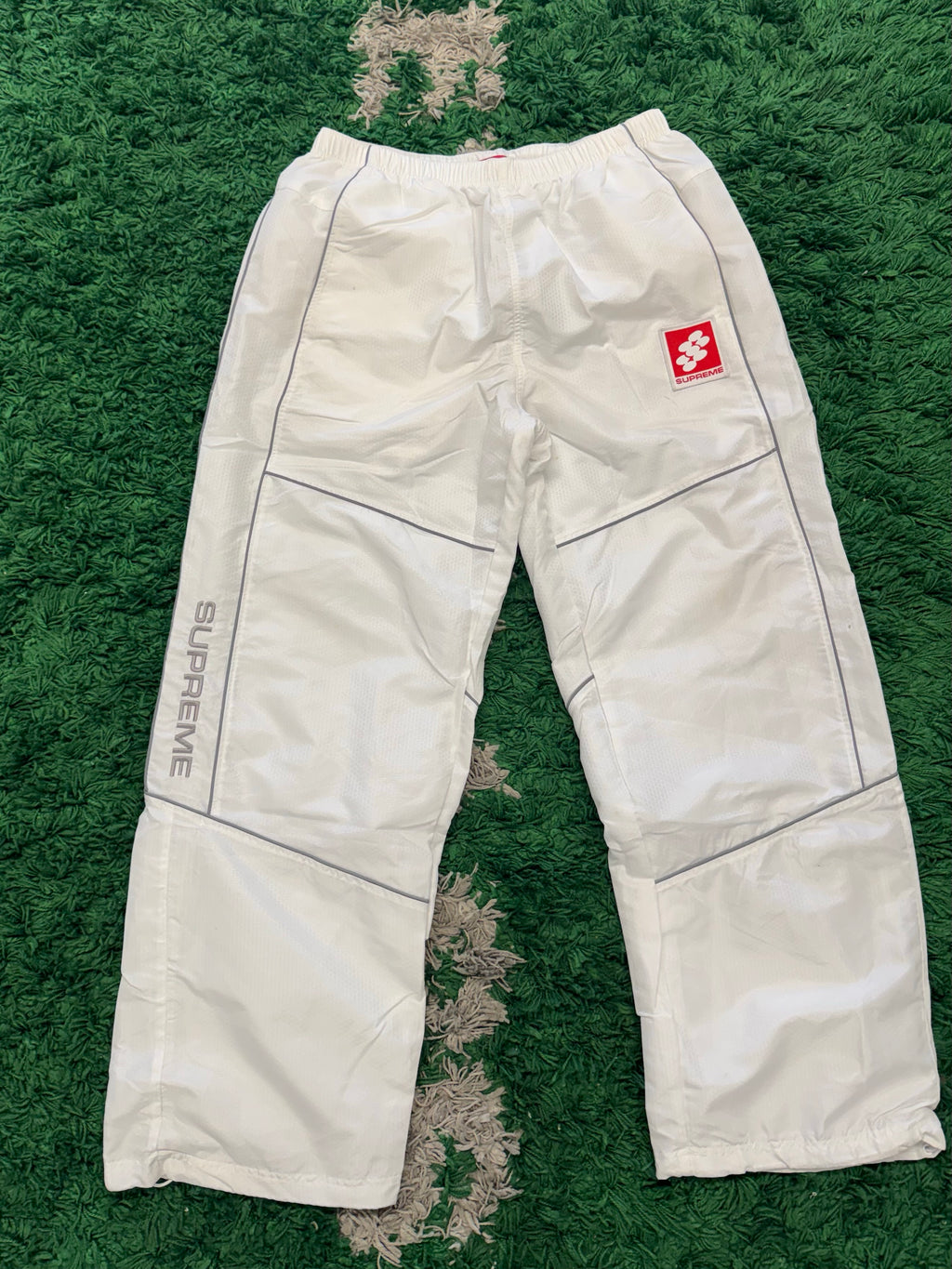 Supreme reflective piping track pants