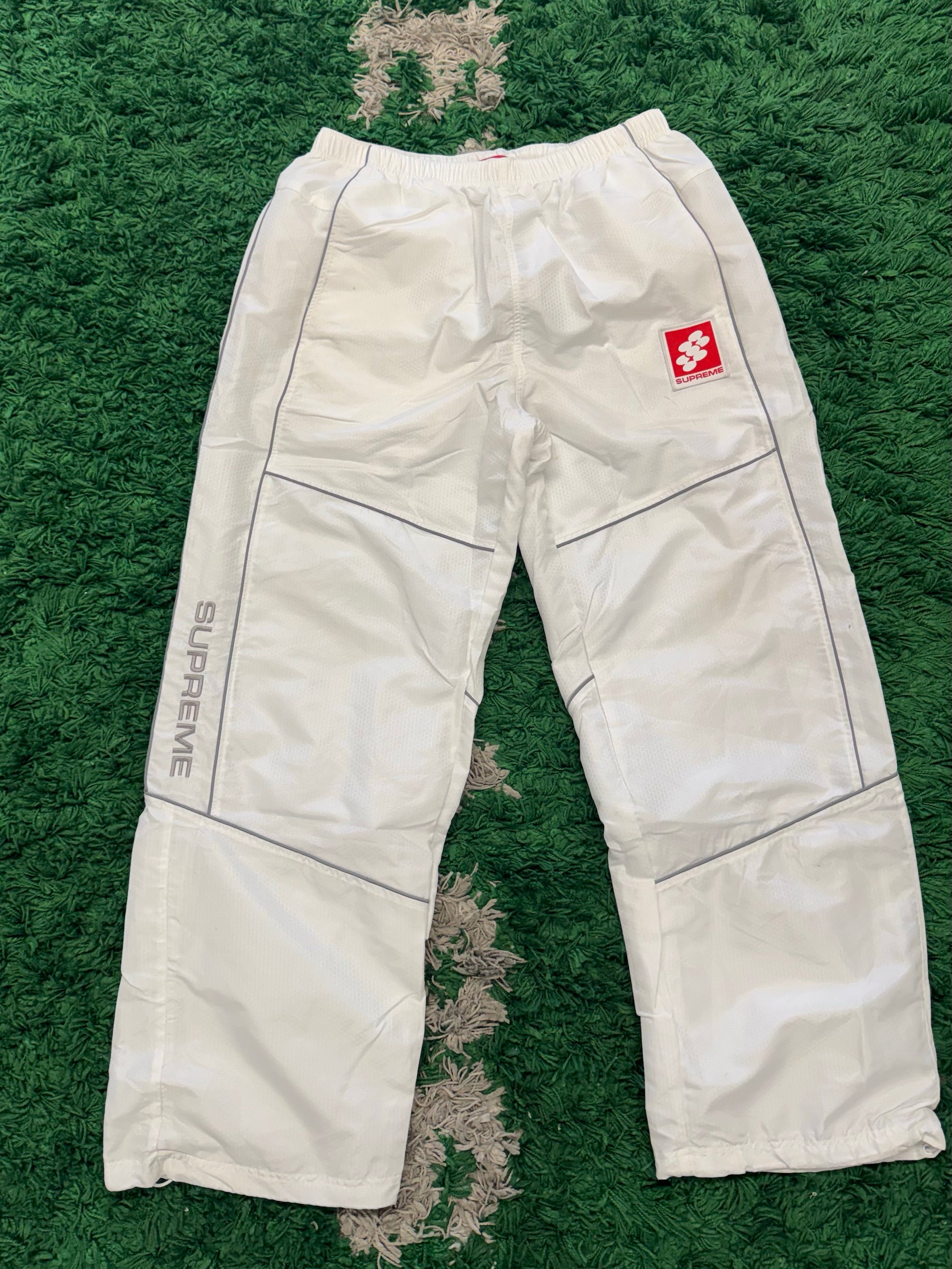 Supreme reflective piping track pants